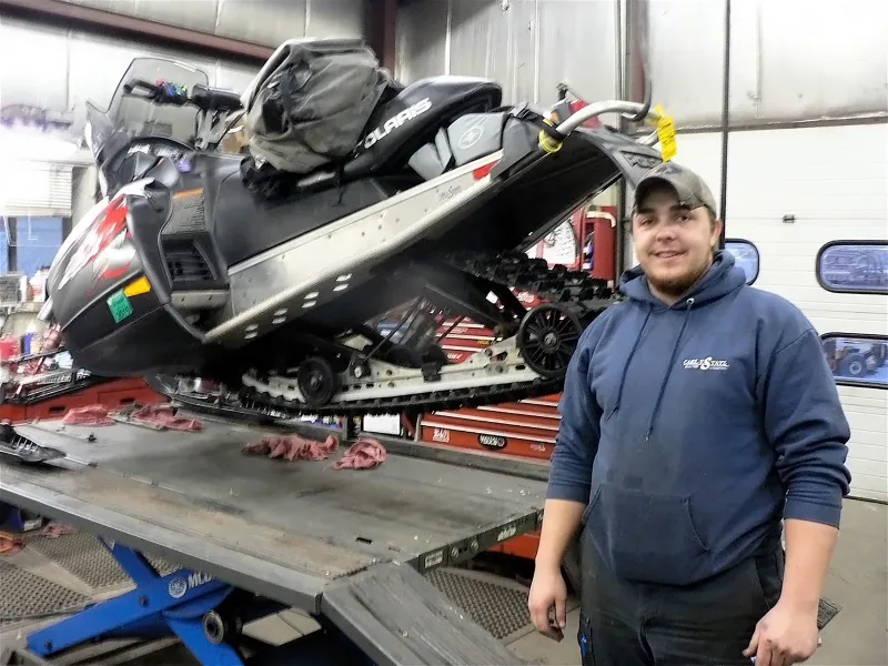 Snowmobile repair at the dealership, photographed in 2018.