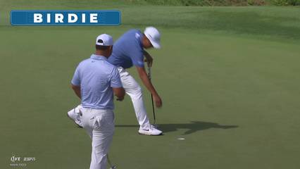 Team Yu/Kim sinks a 21-foot birdie putt on No. 9 at Zurich Classic