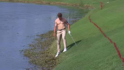 Michael Brennan goes shirtless in attempt to hit shot out of water at Zurich Classic