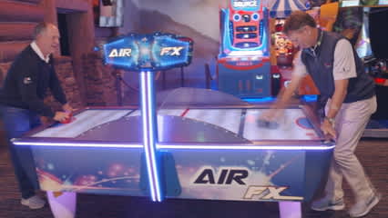 Jay Haas and Brad Faxon compete in the arcade