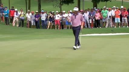 Spencer Levin rolls his 18-foot putt in for birdie at CIMB