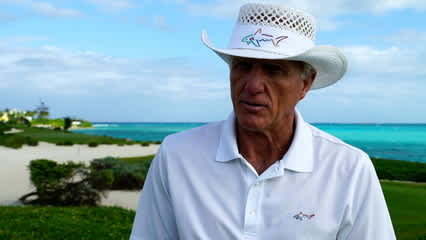 Greg Norman gives Trevor Cone advice prior to the 2019 Great Exuma