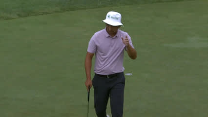 Zecheng Dou drops in a birdie putt at Utah Championship