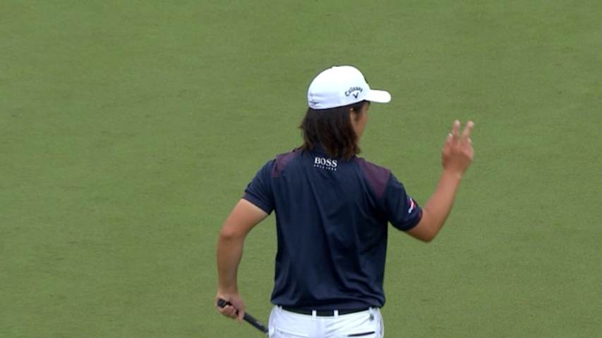 Richard H. Lee rolls in an 18-foot birdie putt at Shell