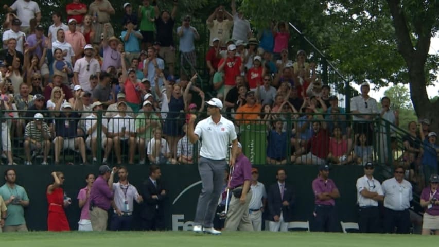Adam Scott drains a clutch birdie on the second playoff hole at Crowne Plaza
