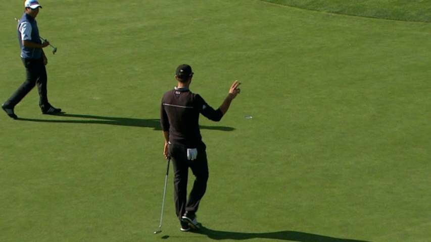 Dustin Johnson pours in a 20-foot putt for birdie at AT&T Pebble Beach