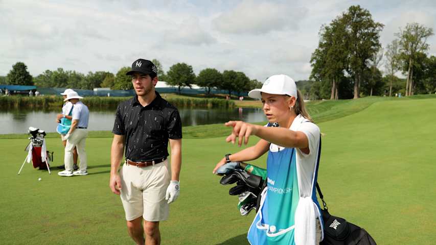 Evans Scholar caddies for Nick Jonas at BMW Championship
