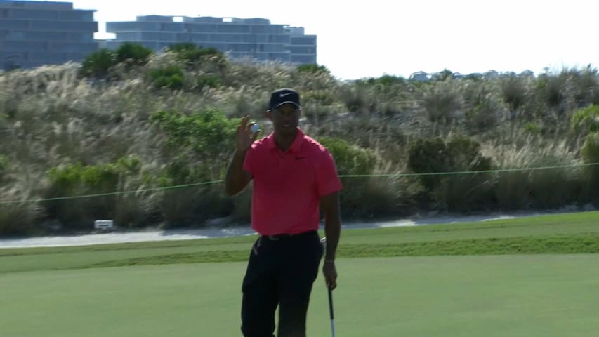 Tiger Woods' bunker splash sets up birdie at Hero