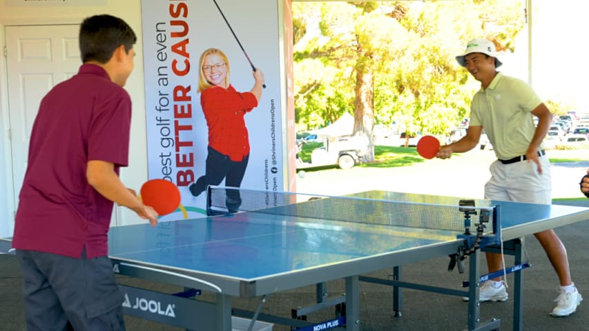 Zecheng Dou plays table tennis with Shriners International Patient Ambassador