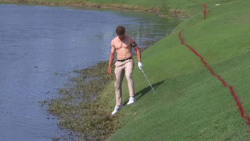 Michael Brennan goes shirtless in attempt to hit shot out of water at Zurich Classic