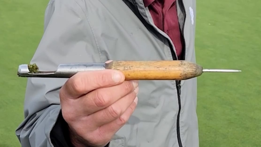 Custom divot repair tool in action at Pebble Beach
