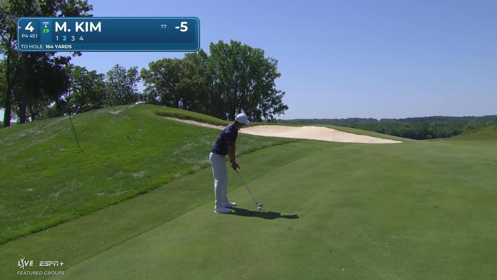 Michael Kim sinks a 25-foot birdie putt on No. 4 at John Deere