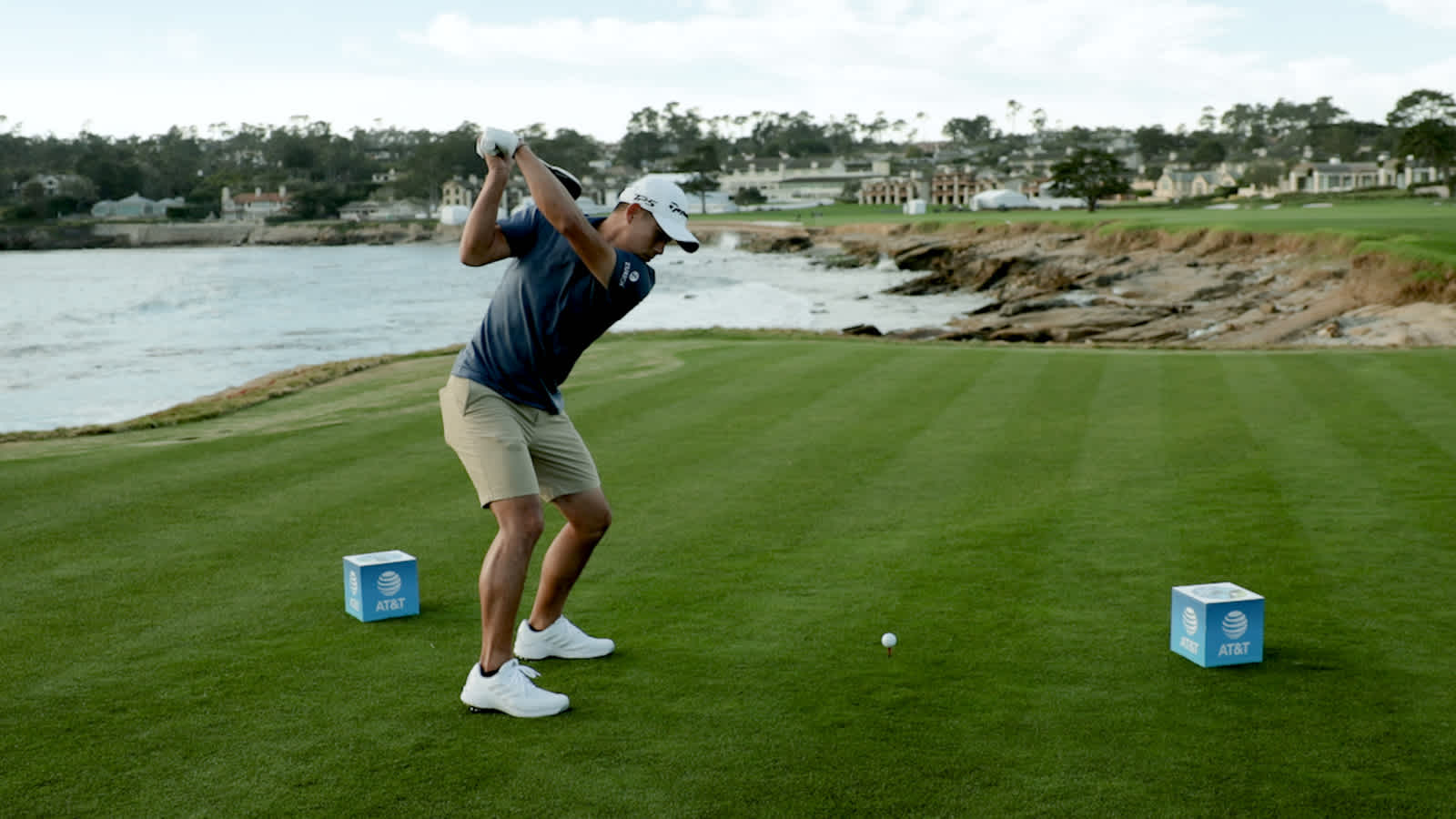 Players talk strategy at the 18th hole at Pebble Beach