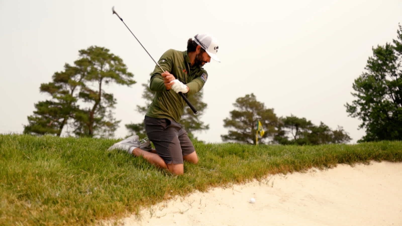 How to hit a bunker shot from your knees like Adam Hadwin
