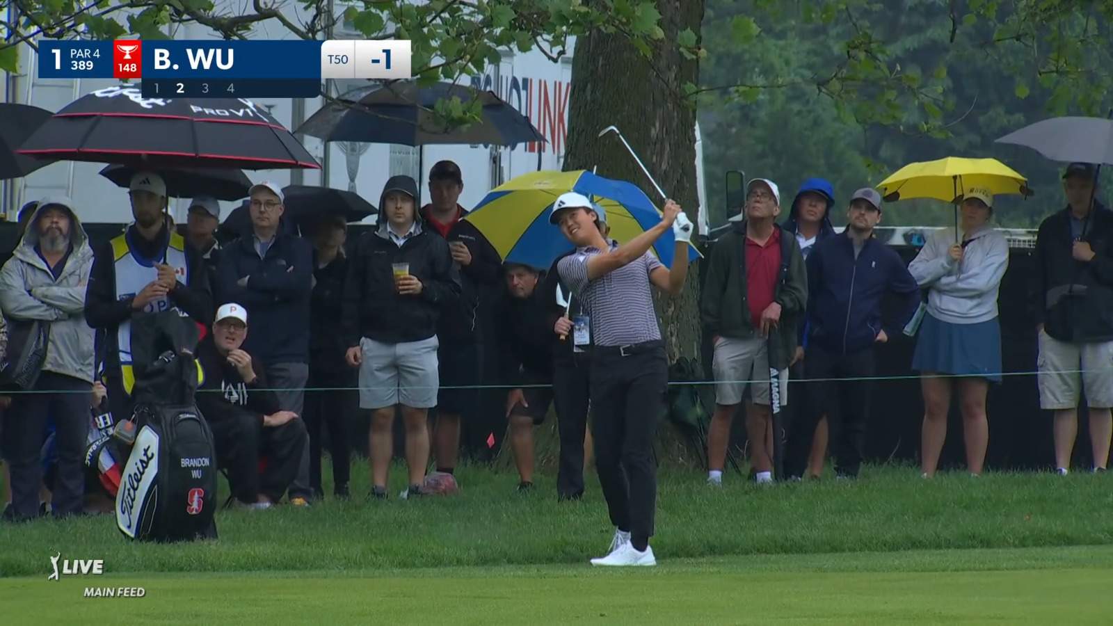 Brandon Wu punches out of the collar and reaches the green at RBC Canadian