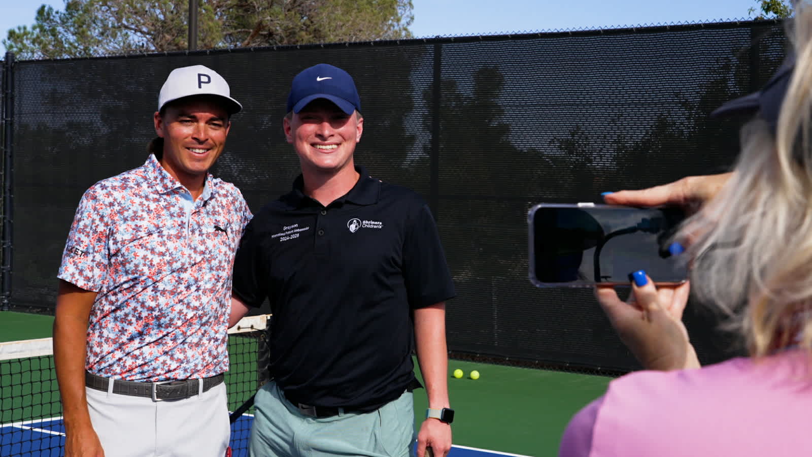 Rickie Fowler plays pickleball with Shriners Patient Ambassador Grayson