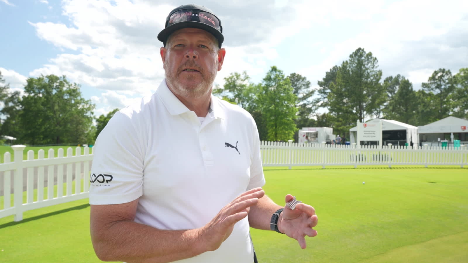 Caddie Tim Tucker describes ball marker to help with putting