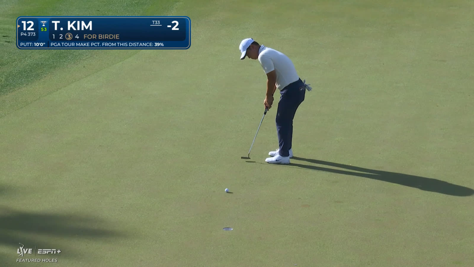 Tom Kim' puts down putt for birdie at THE PLAYERS