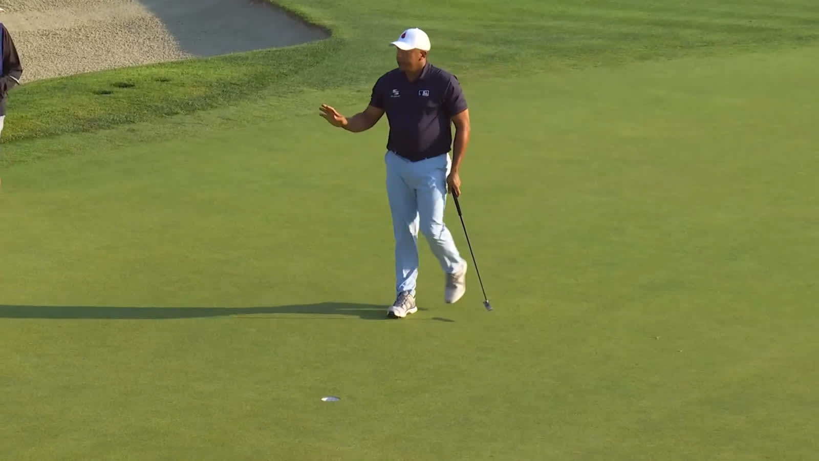 Jhonattan Vegas brushes in a birdie putt at Farmers