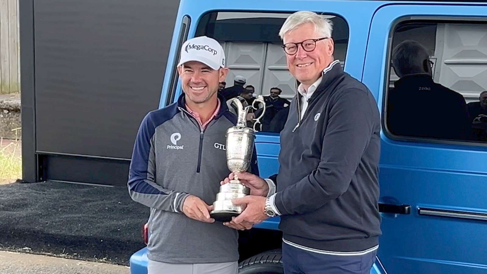 Brian Harman returns the claret jug