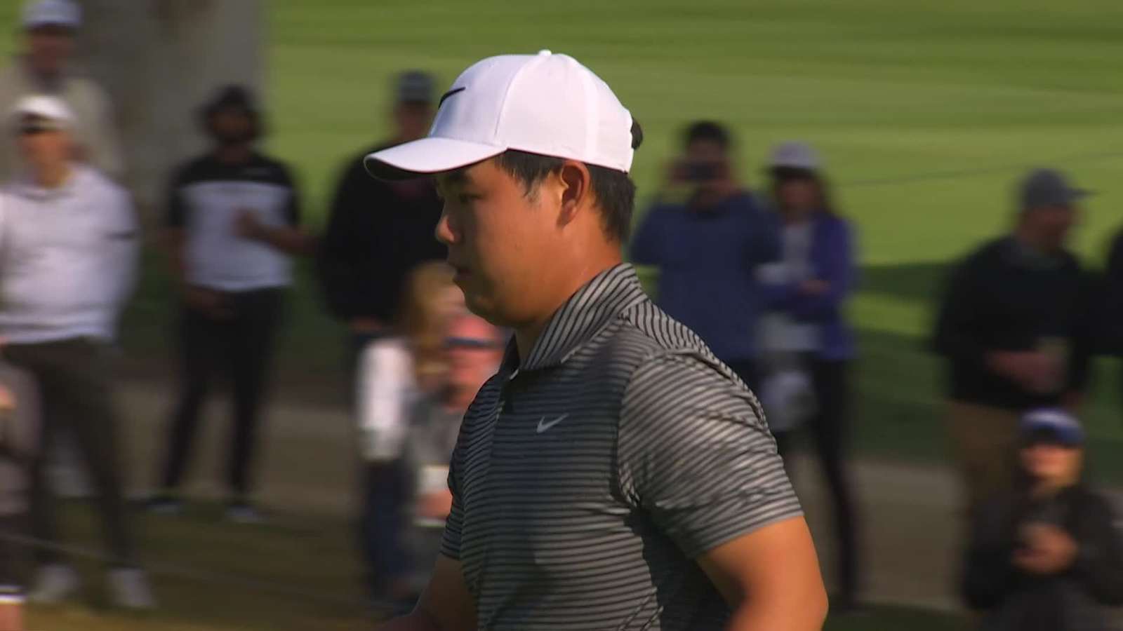 Tom Kim holes a 26-foot birdie putt at Genesis