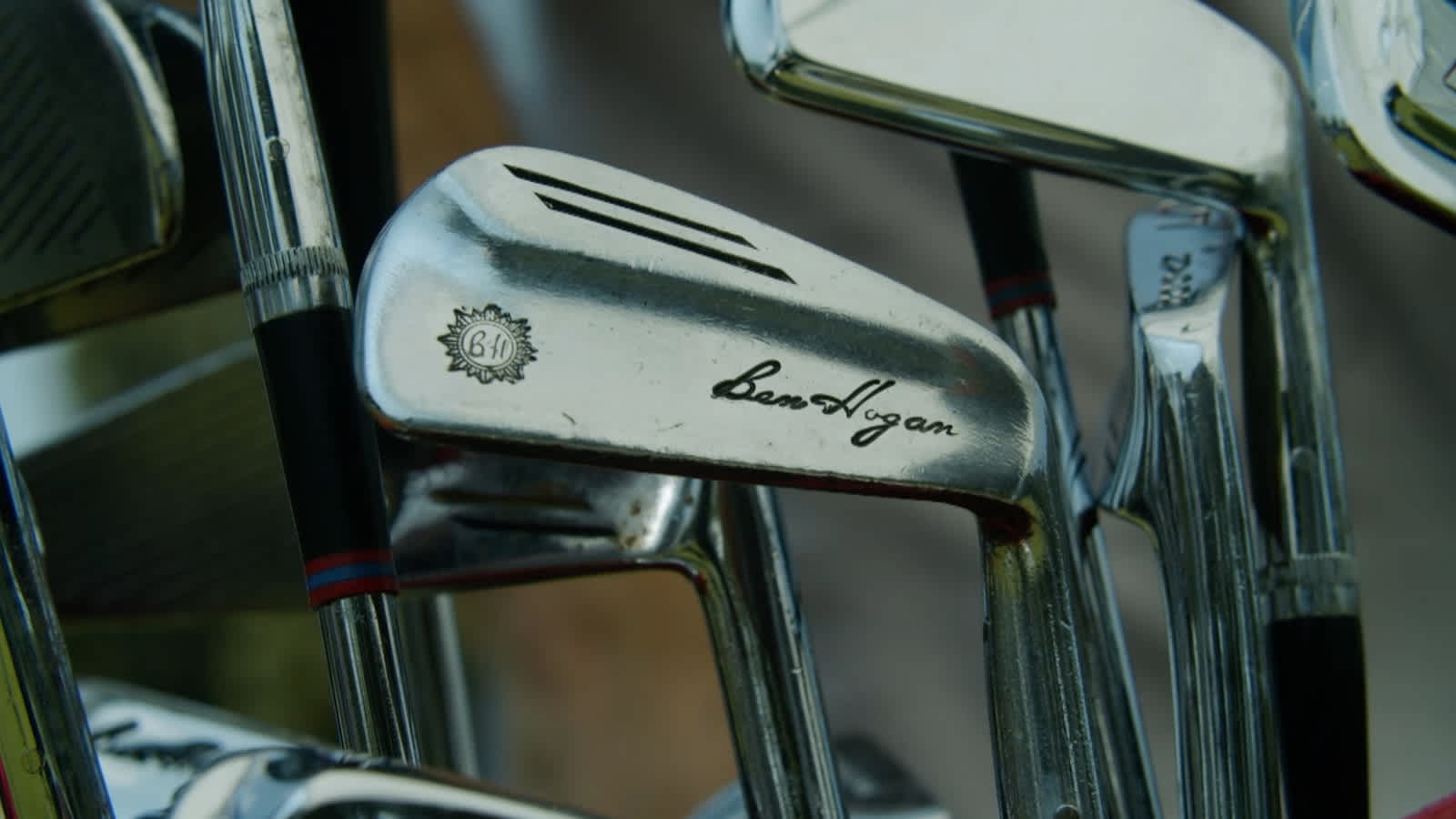 Players hit Ben Hogan’s golf clubs on the range at Colonial