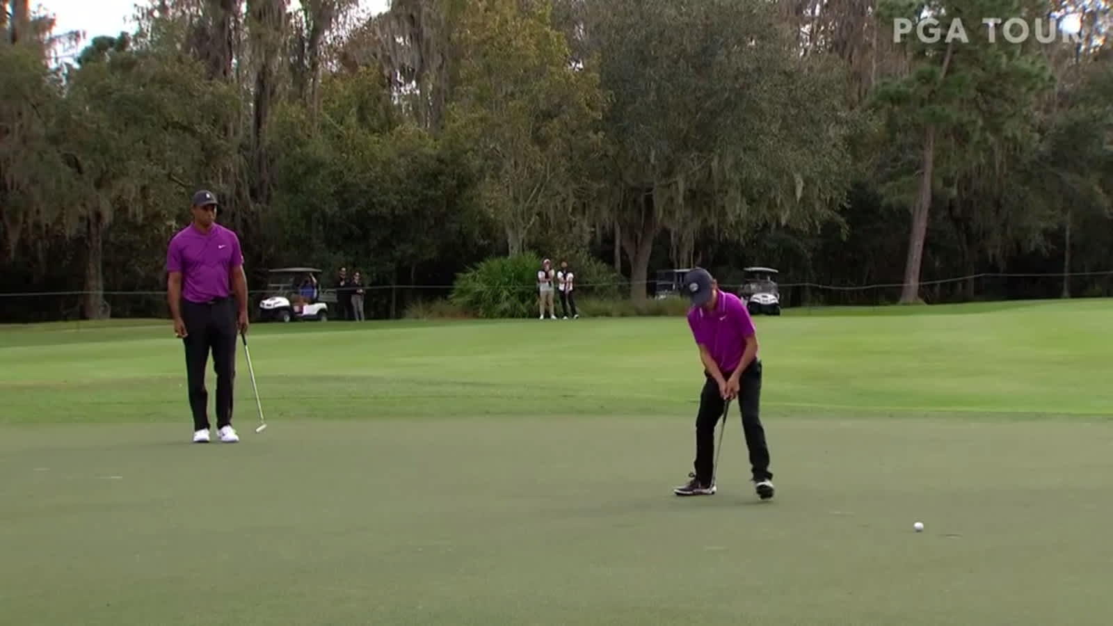 Charlie Woods walks in birdie putt on No. 9 at PNC Championship