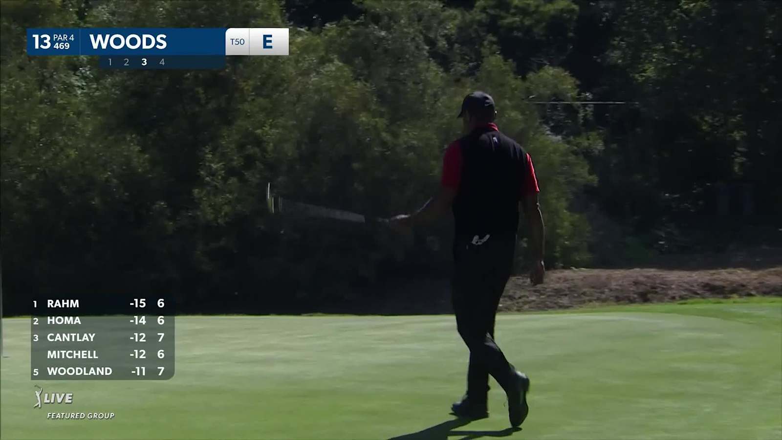 Tiger Woods jars 30-foot birdie putt from off the green at Genesis