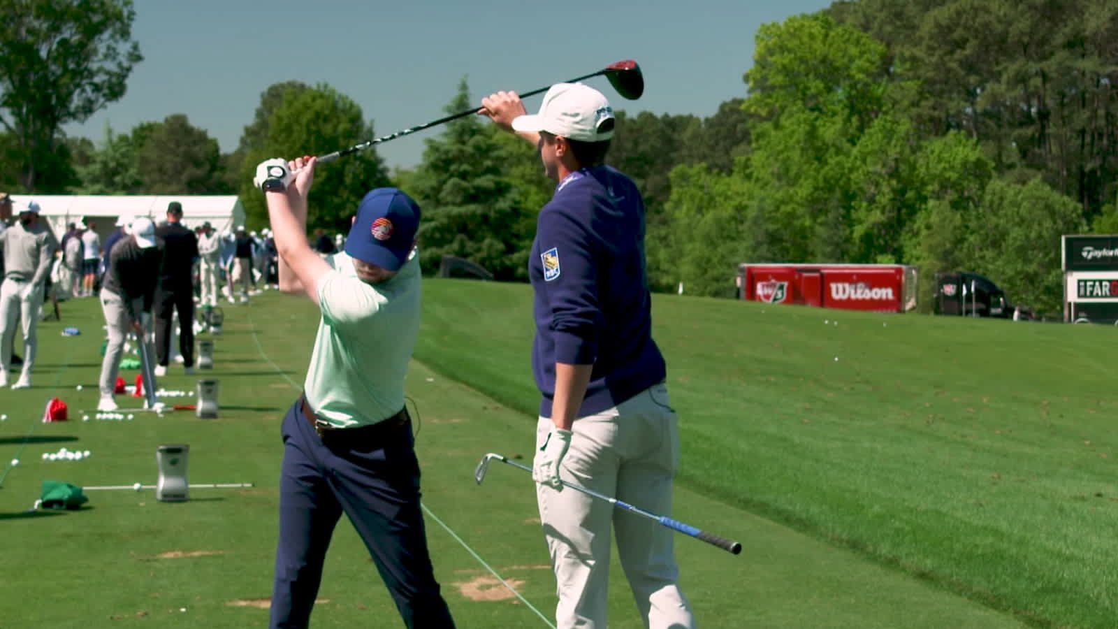 NASCAR drivers work on their swings with Mackenzie Hughes before Wells Fargo