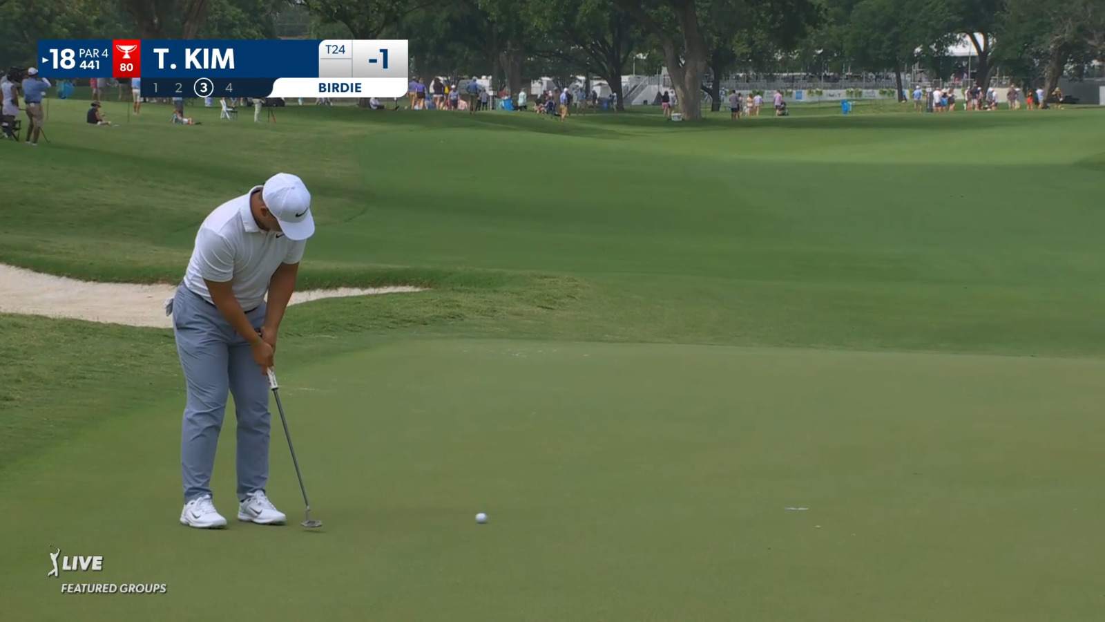 Tom Kim holes birdie putt at Charles Schwab
