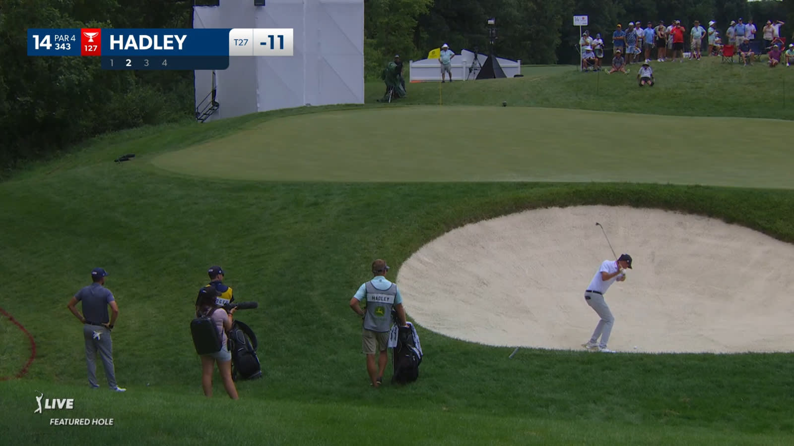 Chesson Hadley punches out of greenside bunker at John Deere