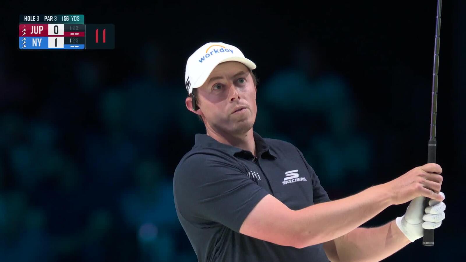 Matt Fitzpatrick throws a dart at TGL