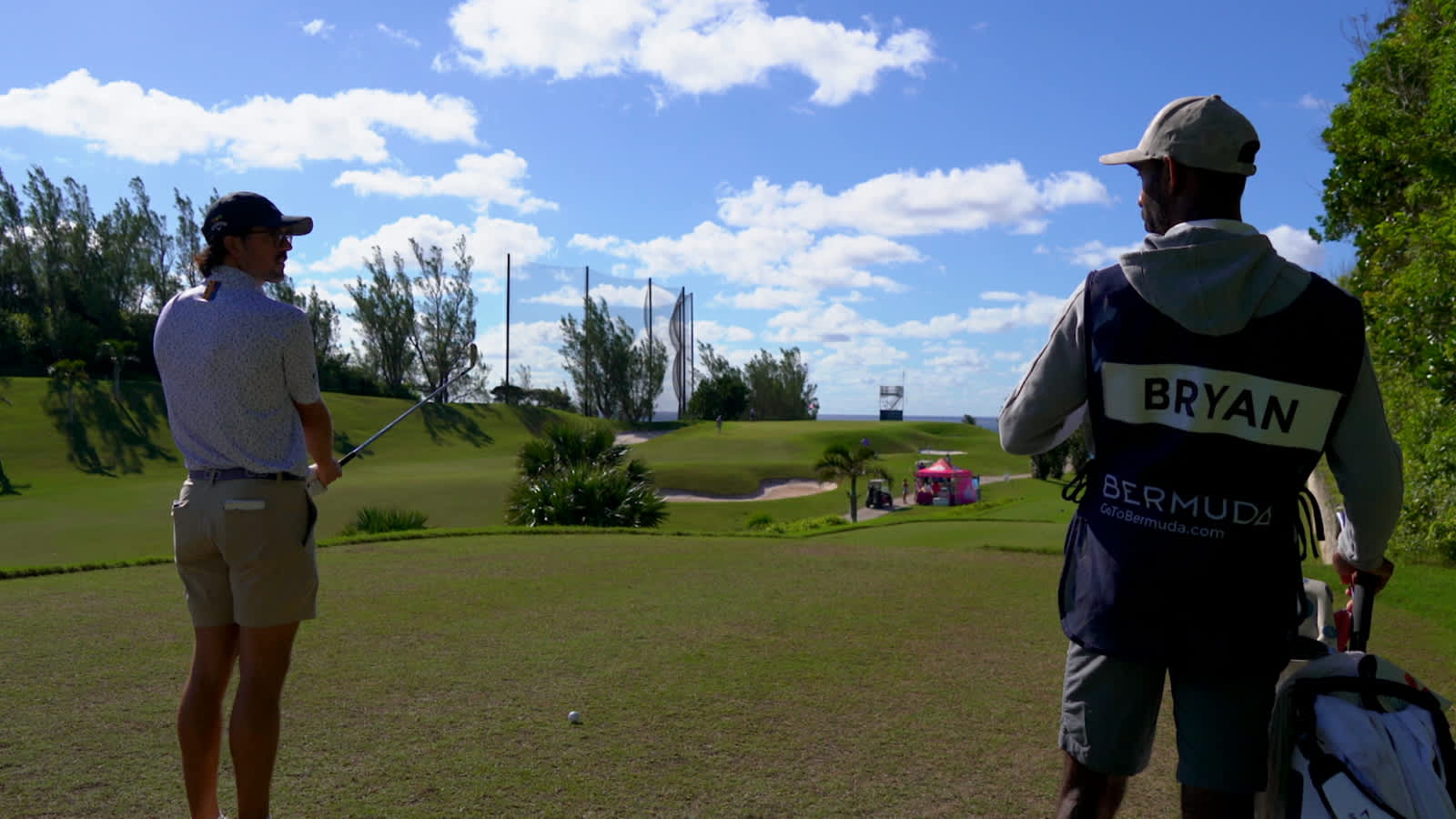 George Bryan and caddie discuss strategy before Butterfield Bermuda