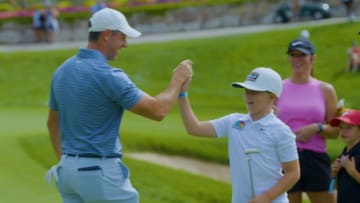 Rory McIlroy spends time with young fan from Dream On 3 ahead of BMW