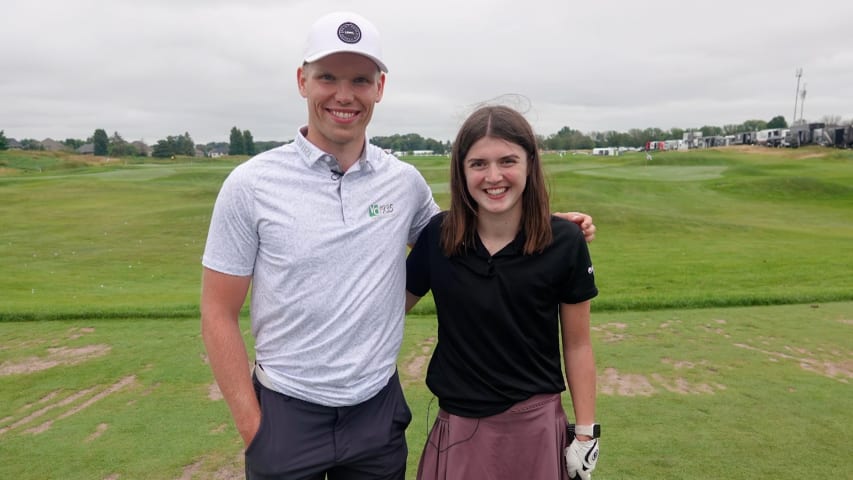 Ben Warian gives First Tee participant tips on her swing and breaking 100