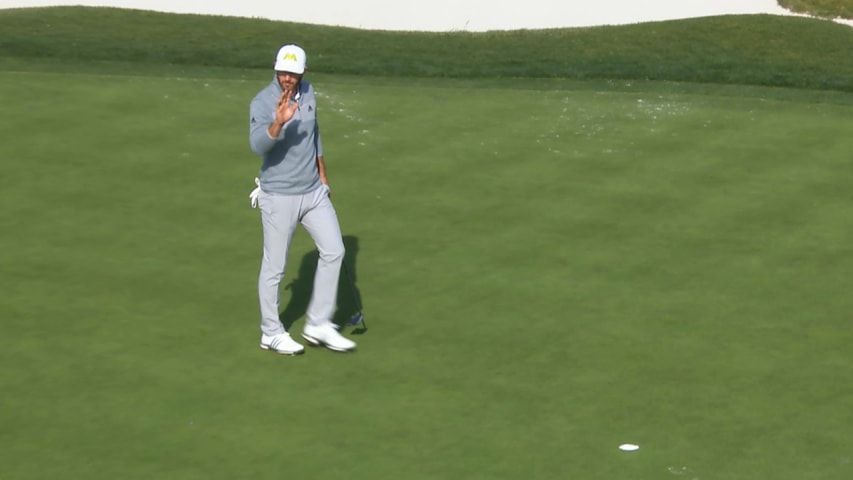 Dustin Johnson pours in his birdie putt on No. 17 at AT&T Pebble Beach