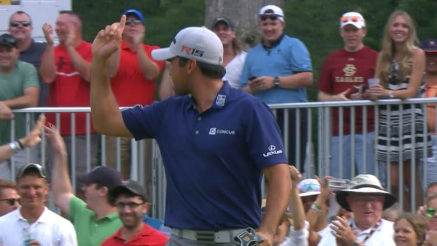 Jason Day walks in his 33-foot putt for birdie on No. 15 at The Barclays