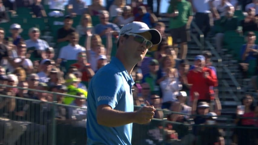 Zach Johnson rolls in a 19-foot putt for birdie on No. 16 at Waste Management