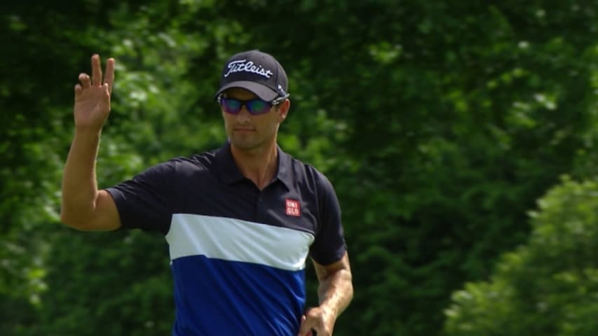 Adam Scott sinks a lengthy birdie putt on the 72nd hole at Crowne Plaza