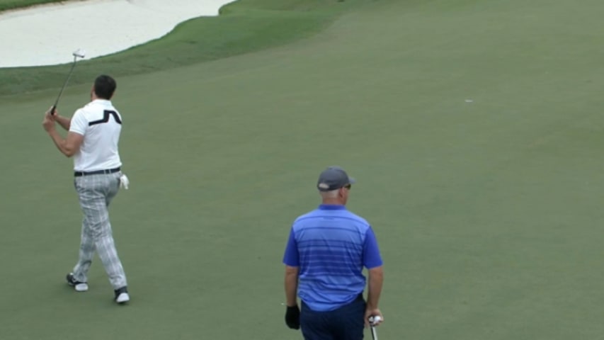 Stuart Lyle knocks in his 21-foot putt at PNC Father/Son