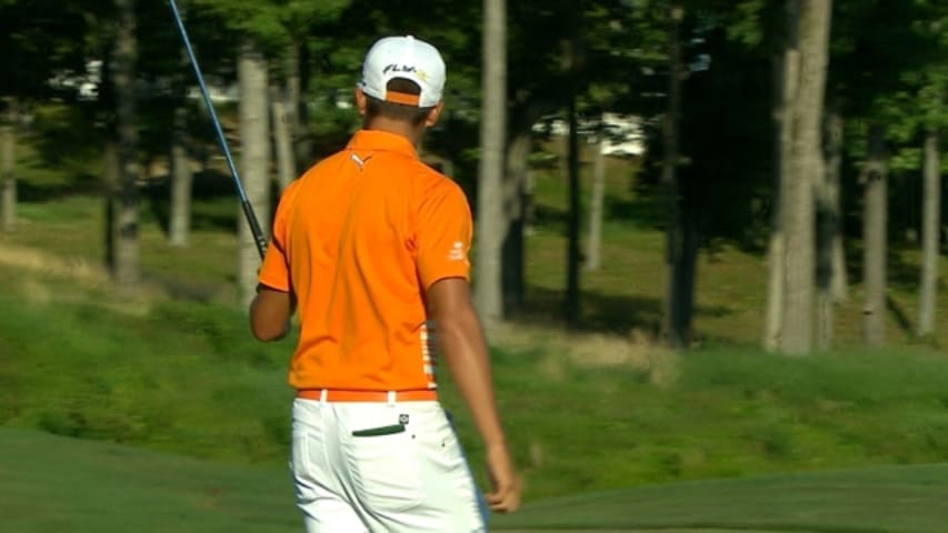 Rickie Fowler closes with a 23-foot putt on the 72nd hole at Quicken Loans