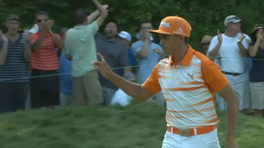 Rickie Fowler buries a 38-foot putt for birdie on No. 14 at Deutsche Bank