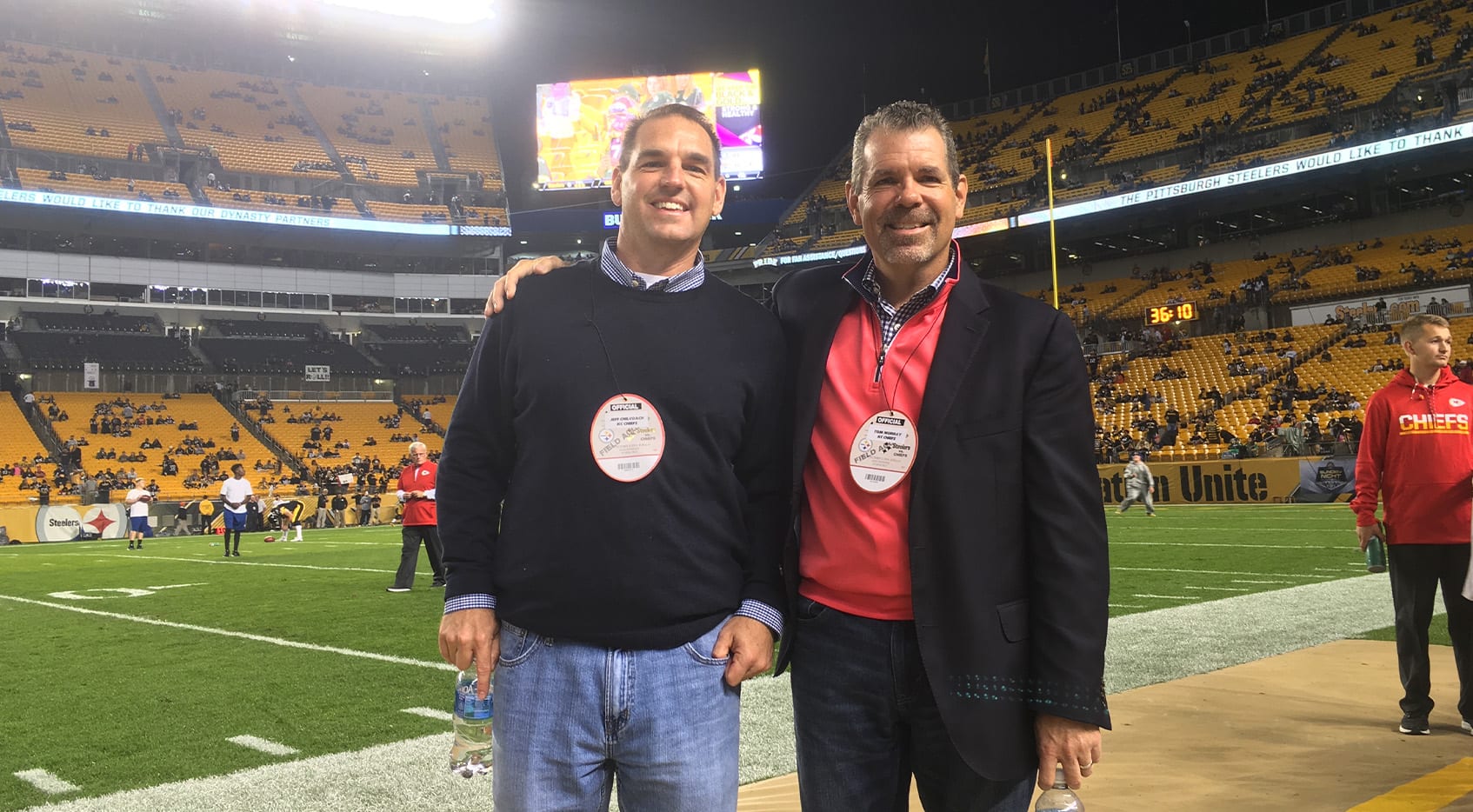 Jeff Chilcoat (left) and Tom Murry (right) at a football game.