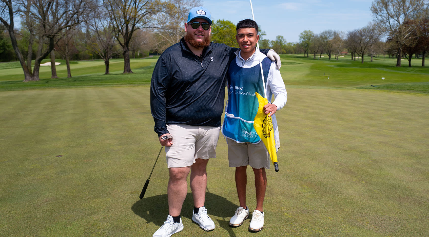 From left to right, country music star Luke Combs with Diego Origel at the BMW Championship pro-am. (Courtesy Evans Scholar Foundation)