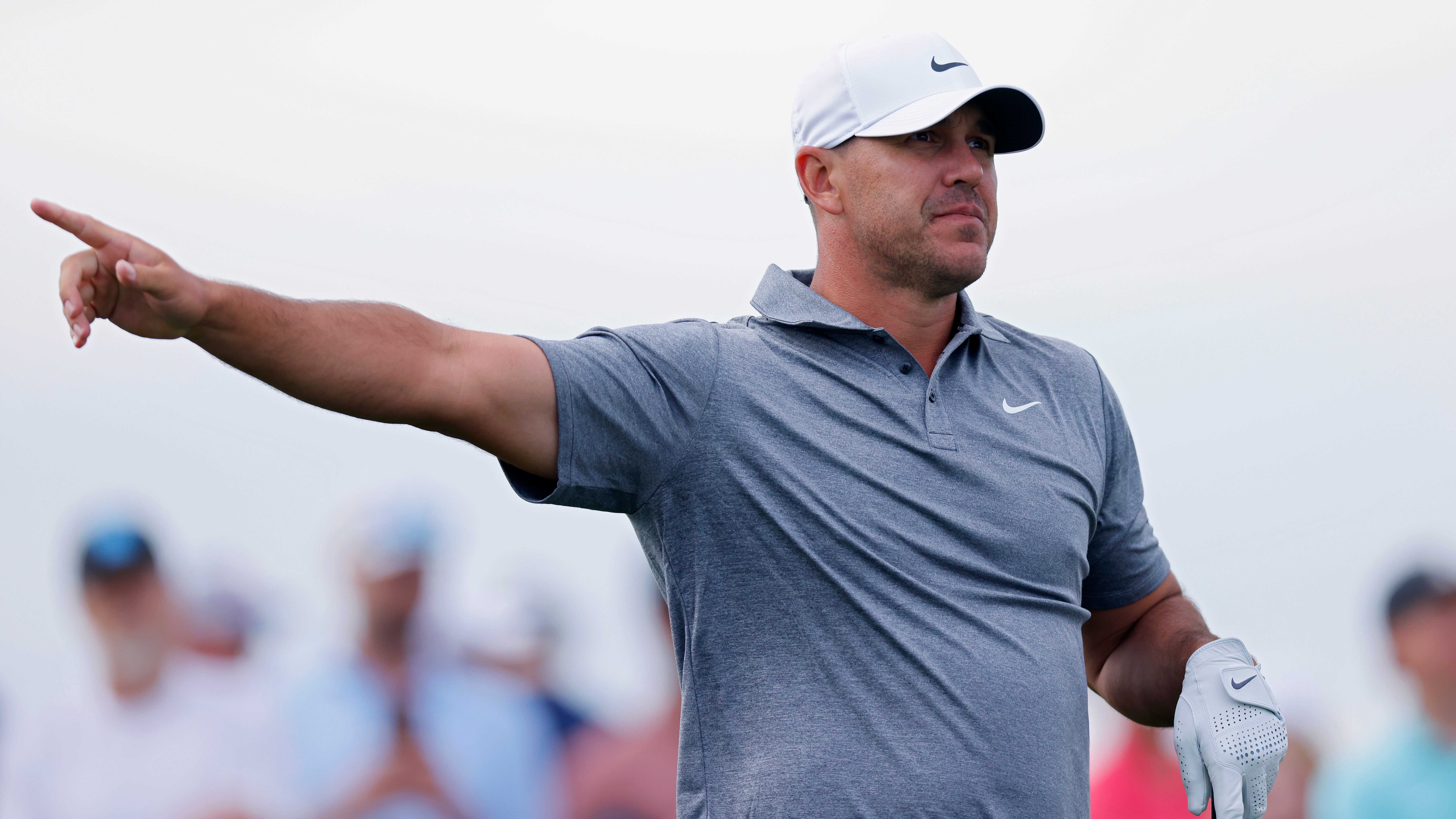 Big names survive busy cutline, while Brooks Koepka heads home