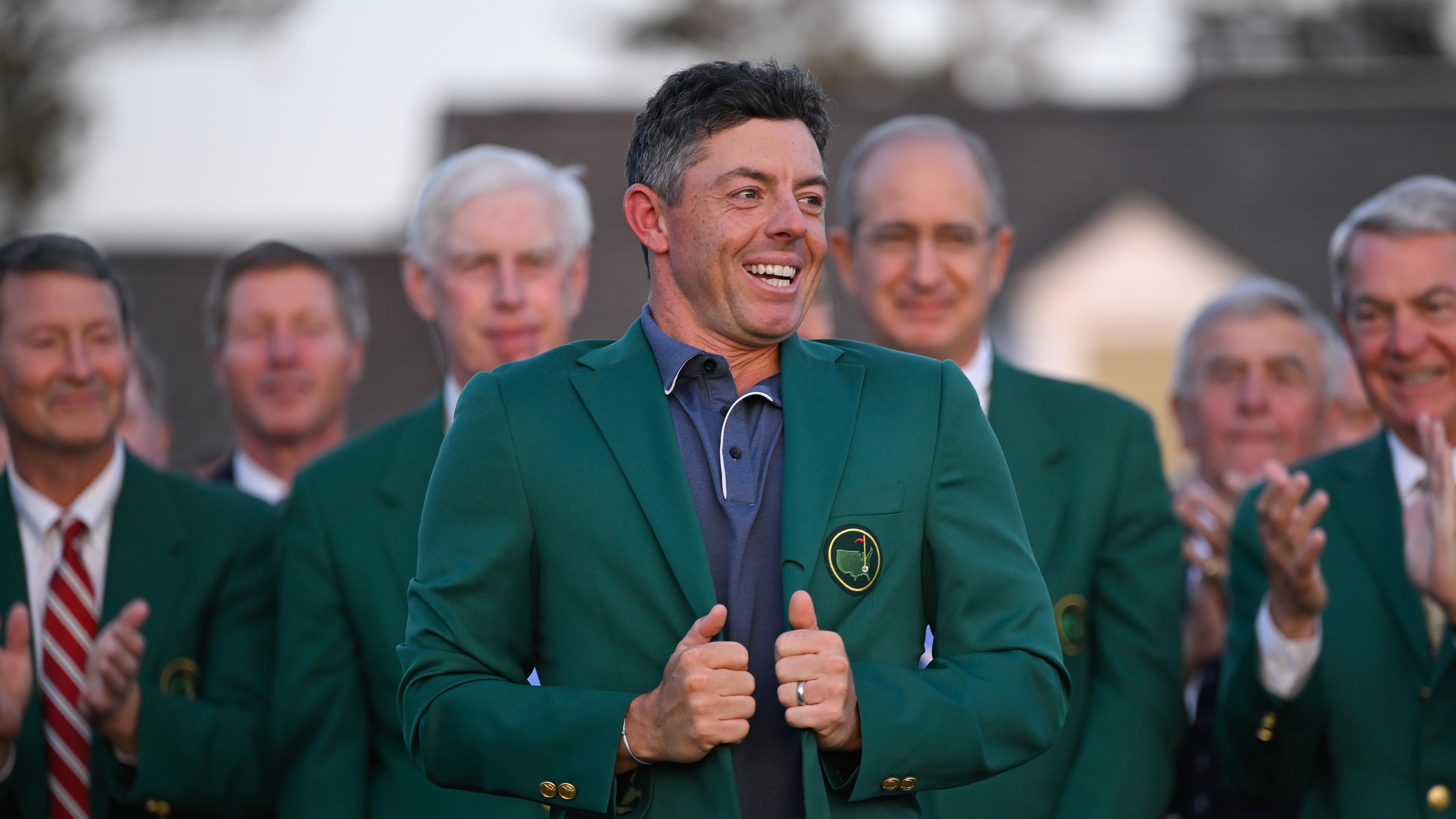 Who awards the Masters champion his green jacket if the winner is