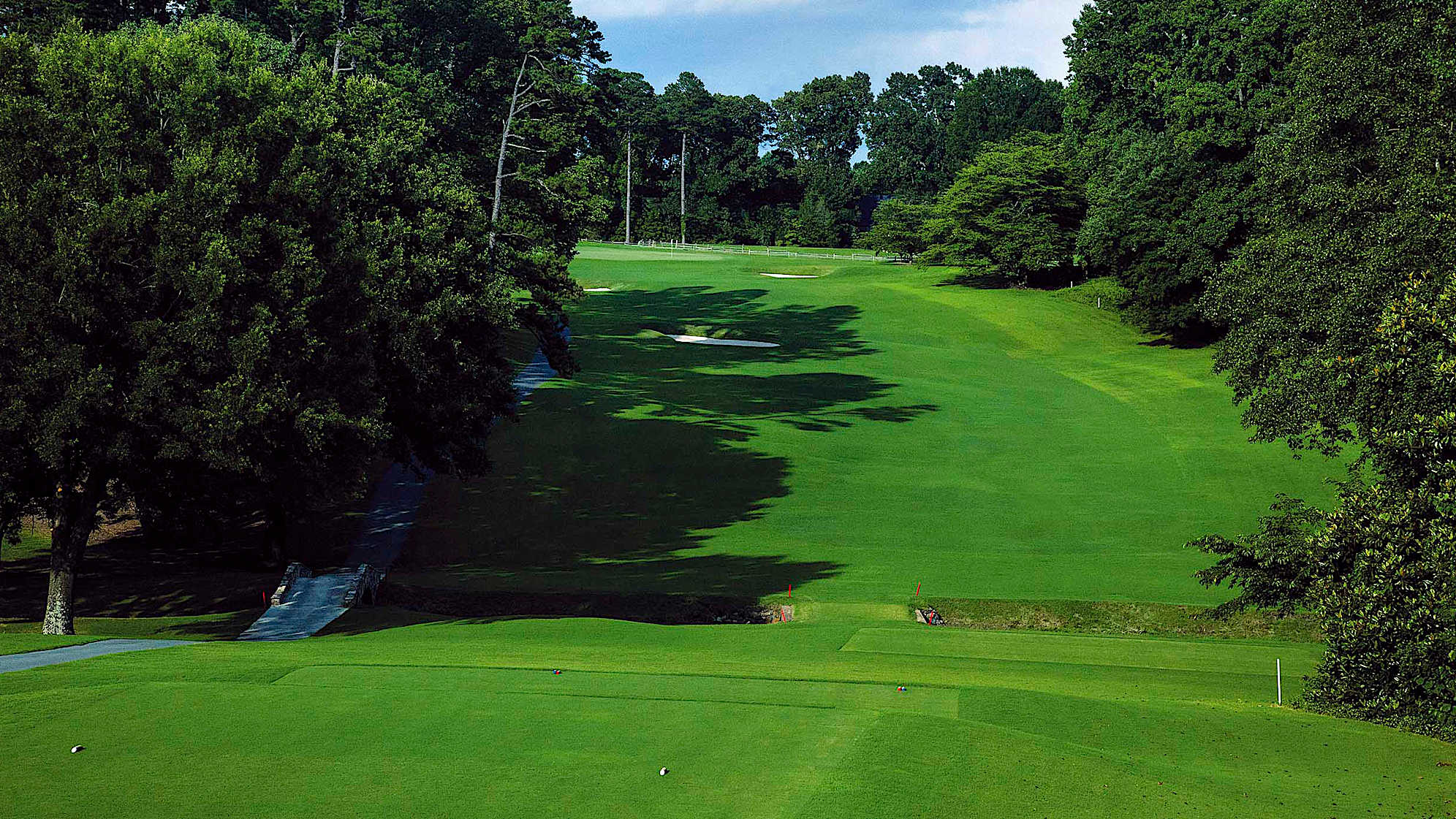 A demanding start to the incoming nine playing downhill from the tee and uphill to the back to front sloping green. You must avoid the left fairway bunker.