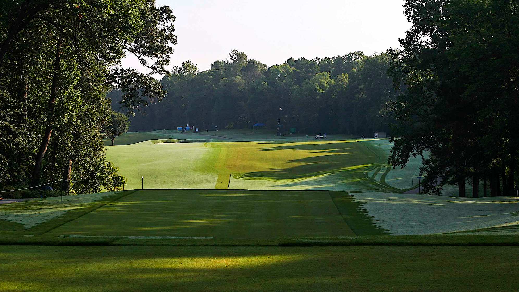 A wide fairway awaits this long par 4. Two center line bunkers create a deceptive approach shot to the skyline green. A restored pot bunker challenges the approach shot from the right side.