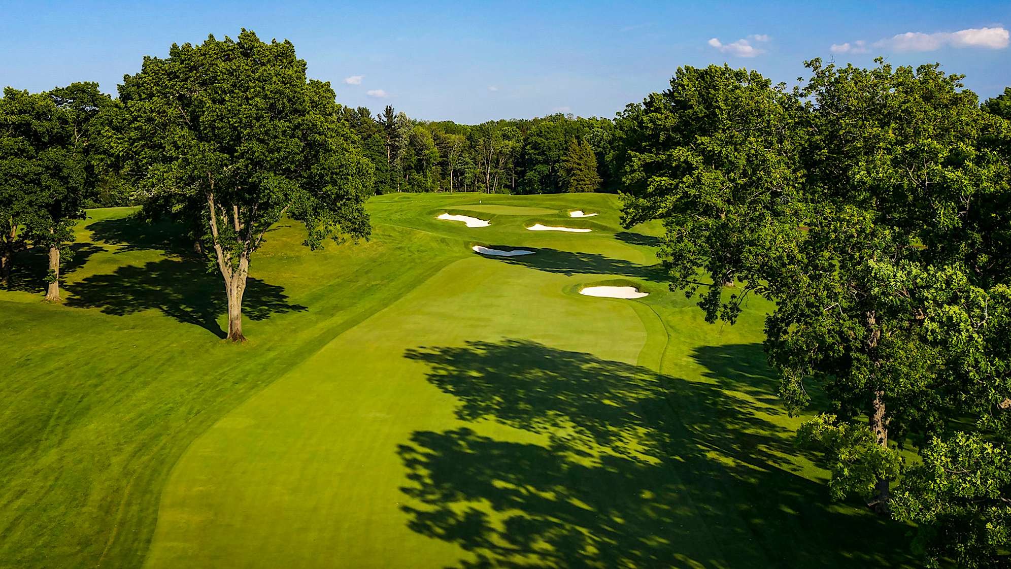 A short uphill par 4 with trees on both sides requires an accurate tee shot. A small right fairway bunker demands a carry of at least 285 yards. The short approach shot is hit to a green that slopes from back left to front right with three greenside bunkers guarding the front. (Source: PGA of America)