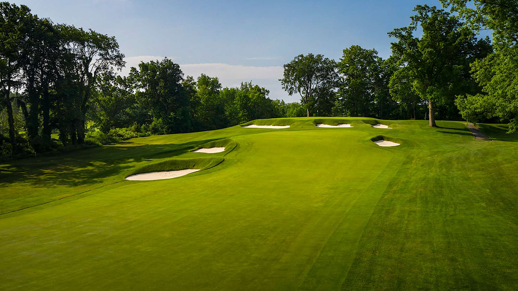 The shortest par 4 on the course will provide the player with a risk-reward decision to lay up or go for the green off the tee. Individuals who layup short of the green must avoid the two fairway bunkers on the left, and one on the right. Those who decide to go for the green may be pleased to have their ball land in one of the three greenside bunkers. Any shot that misses long will provide the toughest of all finesse wedge shots, as this green slopes severely from back to front. (Source: PGA of America)
